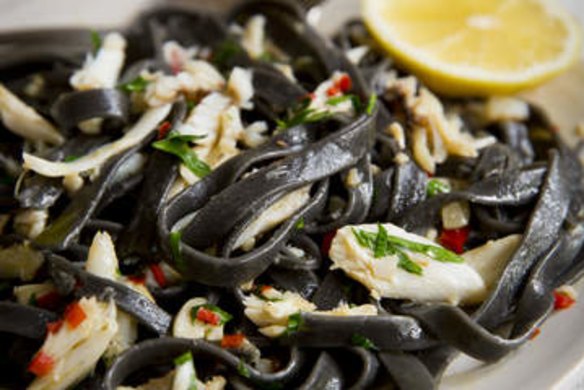 Squid ink fettuccine with crab and chilli.