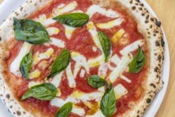 The classic margherita pizza, with an authentic charred crust.