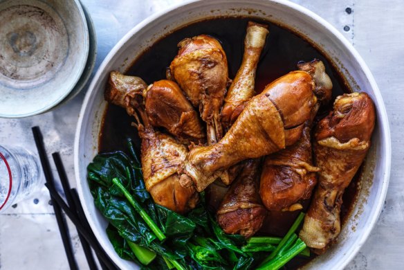 Soy-poached chicken drumsticks with Chinese broccoli.