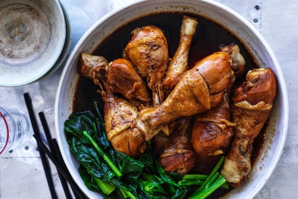 Soy-poached chicken drumsticks with Chinese broccoli.