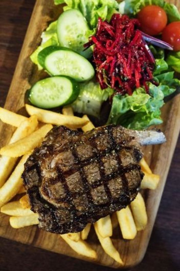 Steak with salad and fries.