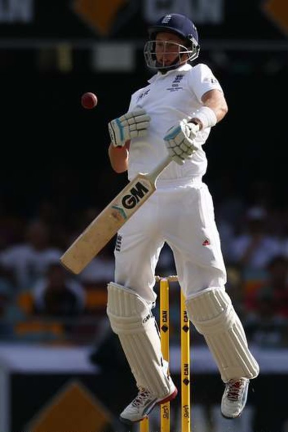 Under pressure: England's Joe Root is forced to take evasive action against Australia's Mitchell Johnson during the first Ashes Test match in Brisbane.