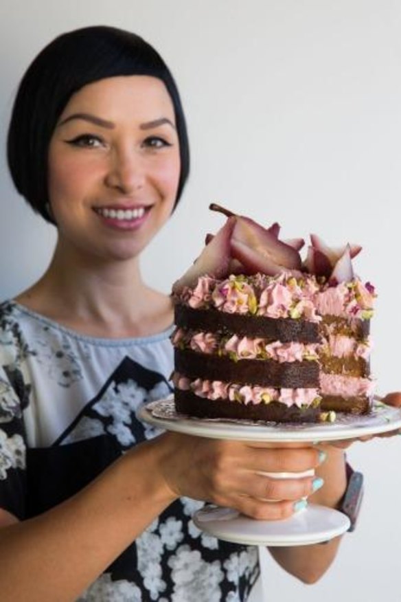 Katherine Sabbath with one of her layer cake creations -  spiced caramel with rosewater cream.
