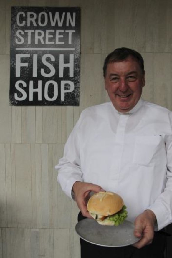 Easter treat: Father Bill with a blessed barra burger.