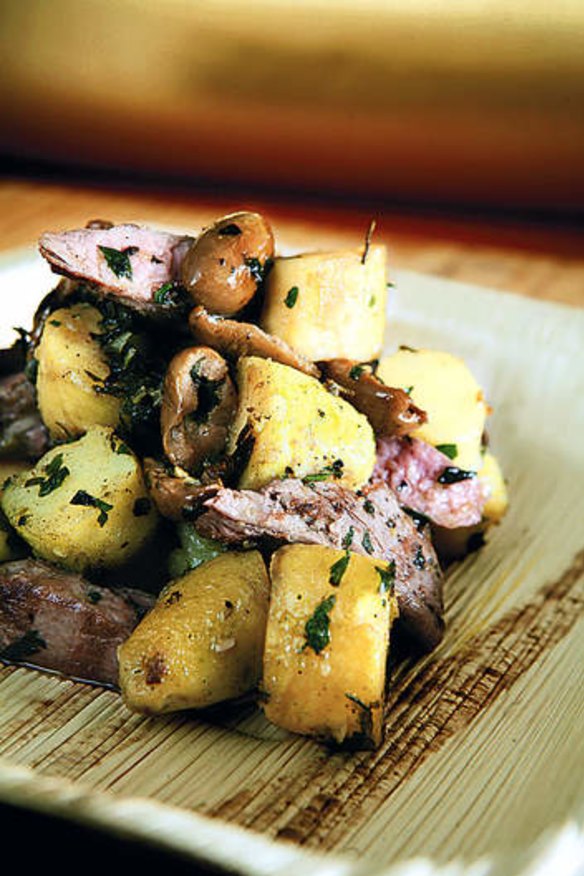 Barbecued lamb fillets with grilled potatoes and olives.