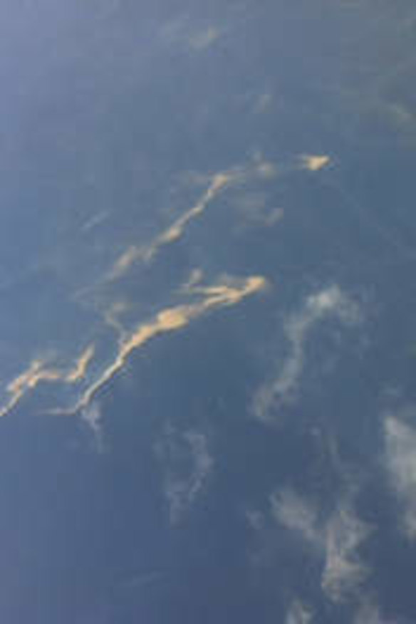 An aerial view of an oil spill is seen from a Vietnamese Air Force aircraft in the search area for a missing Malaysia Airlines plane, 250 km from Vietnam and 190 km from Malaysia, in this handout photo from Thanh Nien Newpaper. REUTERS