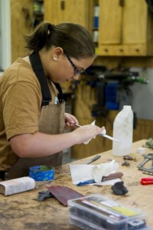 Haddad in her father's workshop.  