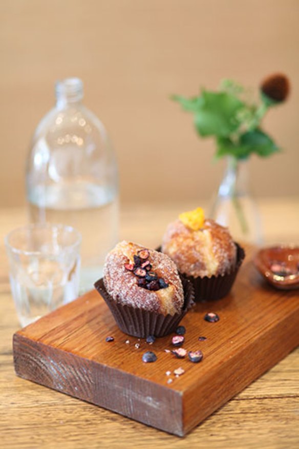 Orange blossom and blueberry donut (left) and mandarin marmalade and chocolate custard donut.