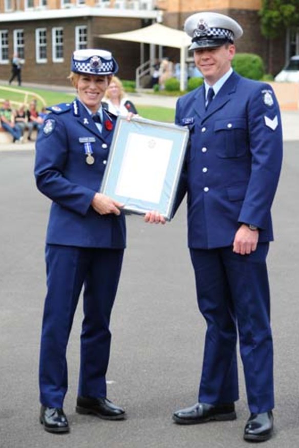 Calum McCann with Assistant Commissioner Lucinda Nolan.