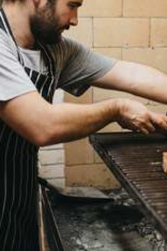 Firing up: Asado's coal-fired parilla barbecue.