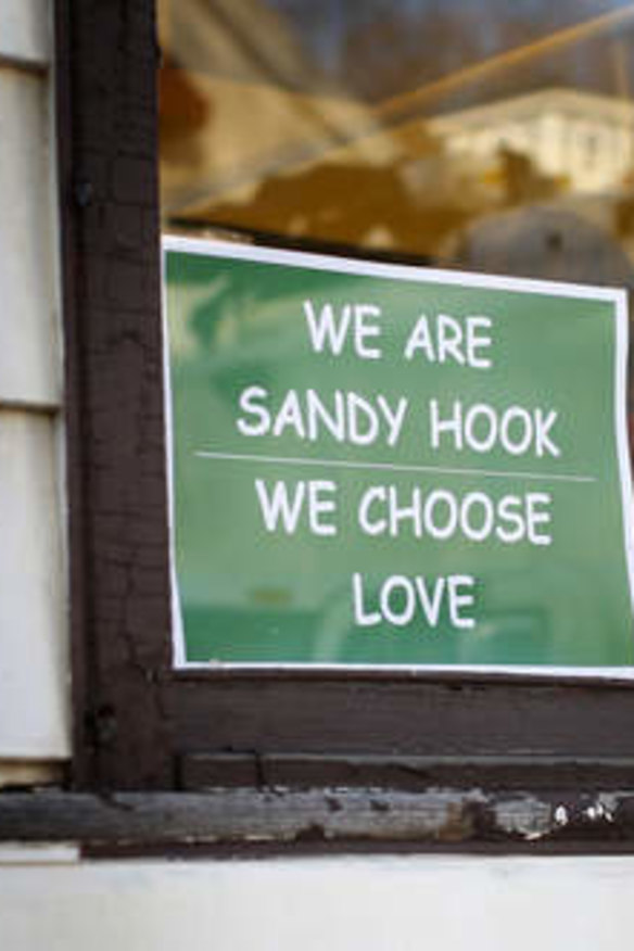 Message of support: The sign designed by Tim Stan has been popping up all over Sandy Hook.