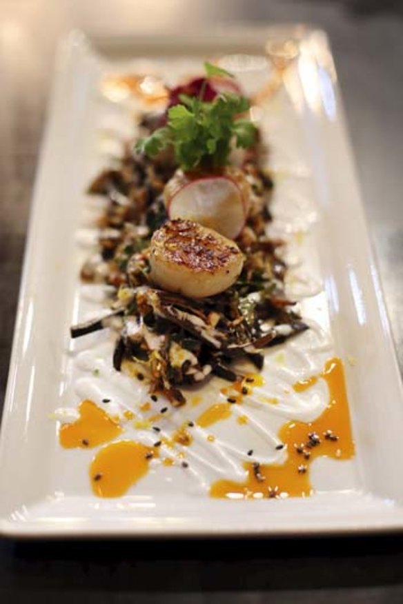 Seared scallops with crispy banana blossoms and chilli jam dressing.