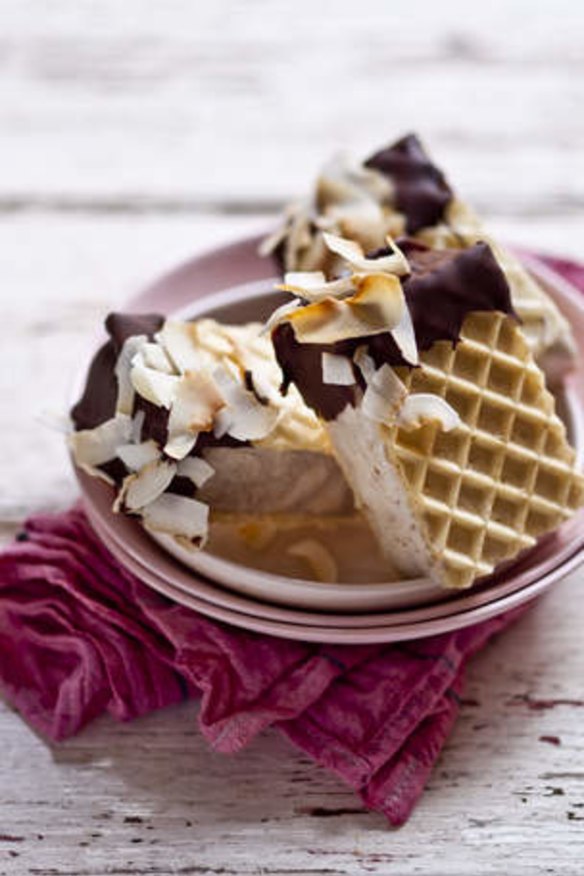 Banana and coconut icecream sandwich with toasted coconut and chocolate coating.