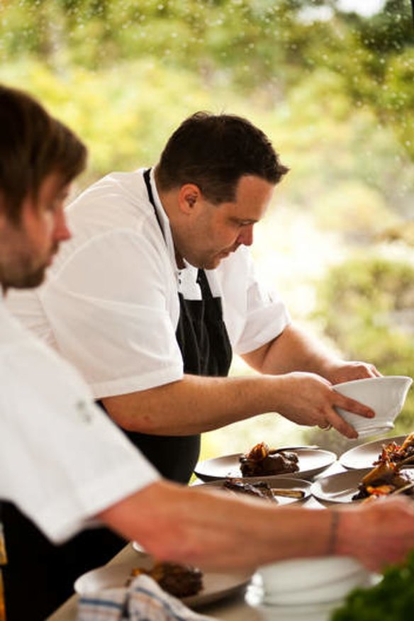 At work: Chef Rob Kabboord plates up, with the help of local butcher Ciaran Condron.