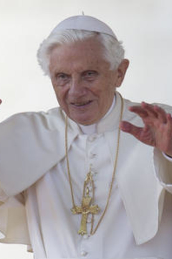 Pope Benedict XVI blesses the faithful in St. Peter's Square at the Vatican for his weekly general audience.