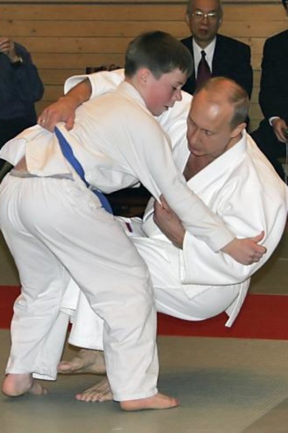 Russian President Vladimir Putin taken down by a student at a judo master class in St Petersburg.