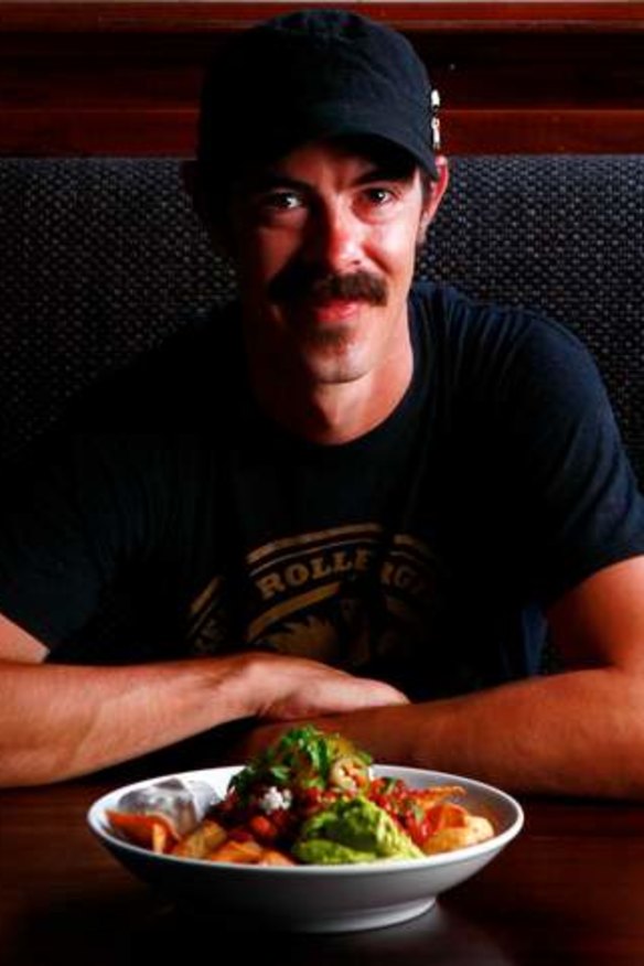 Gasometer Hotel chef Rhys Davies with his vegan chilli bean and steak nachos.