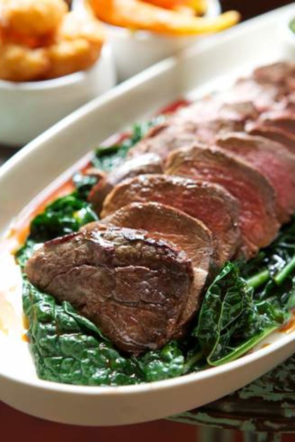 Roasted eye fillet on a bed of wilted cavolo nero.