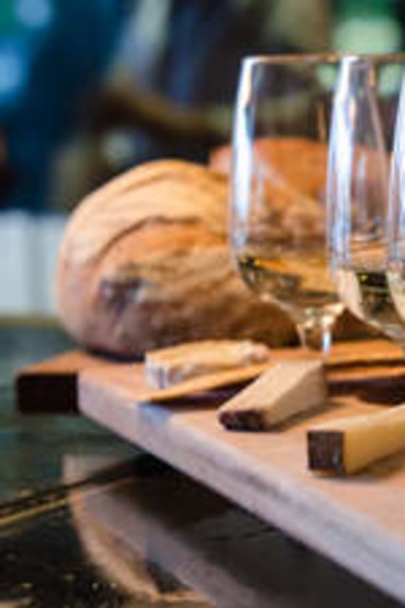 The classic cheese and wine flight at Milk the Cow is a delicious, luxurious experience.
