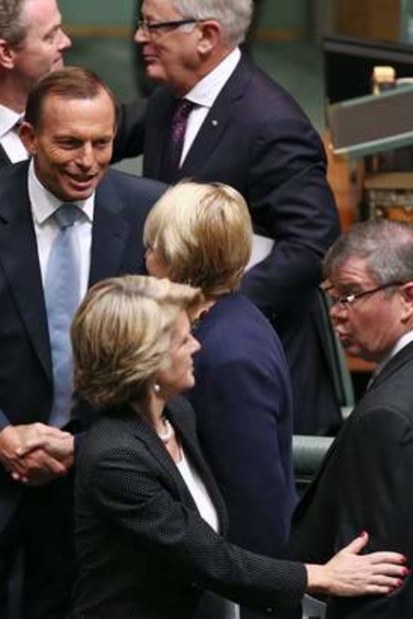 Prime Minister Tony Abbott shakes hands with Labor MP Jenny Macklin after delivering the Closing the Gap report.