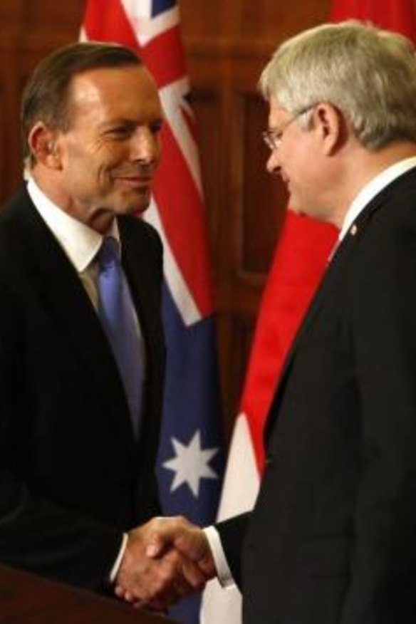 Soulmates: Prime Minister Tony Abbott shakes hands with Canadian Prime Minister Stephen Harper. 