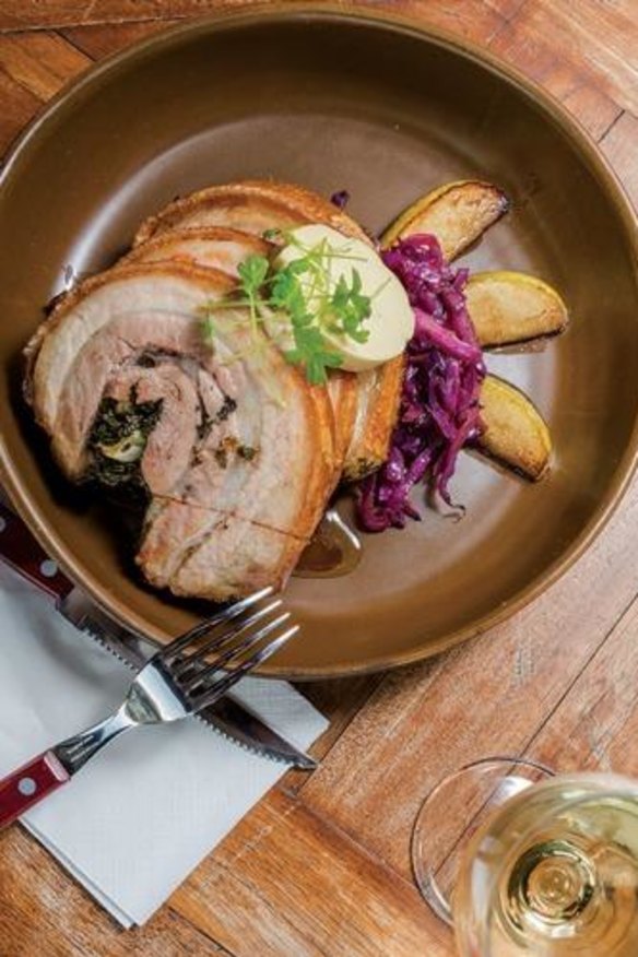 Herb-stuffed porchetta with caramelised apples and braised cabbage at the Star Hotel.