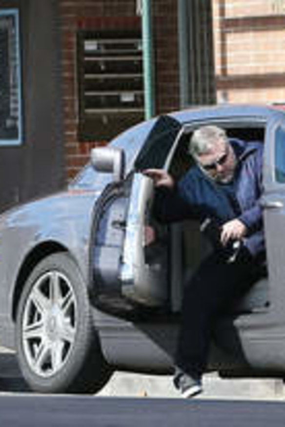 That's how he rolls … Sandilands alights from one of his three Rolls-Royces.