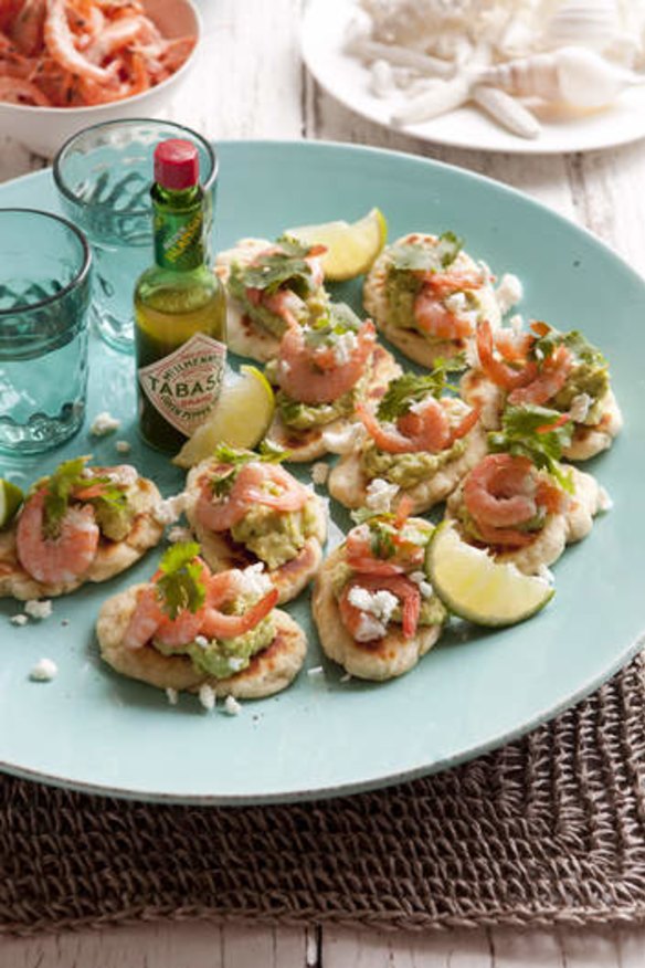 Little prawn pizzas with avocado and lime.