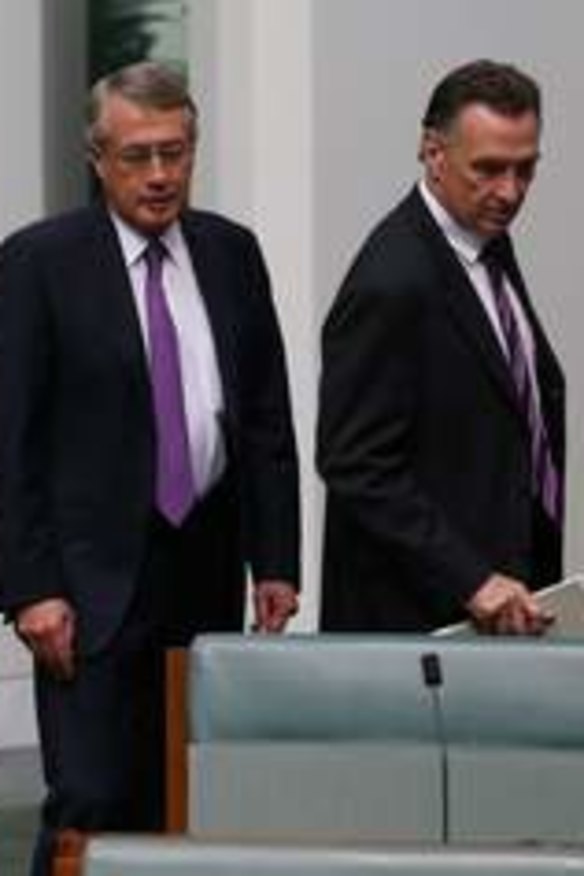 The day after … Julia Gillard enters the House of Representatives as a backbencher on June 27, flanked by supporters (from left) Greg Combet, Wayne Swan and Craig Emerson.