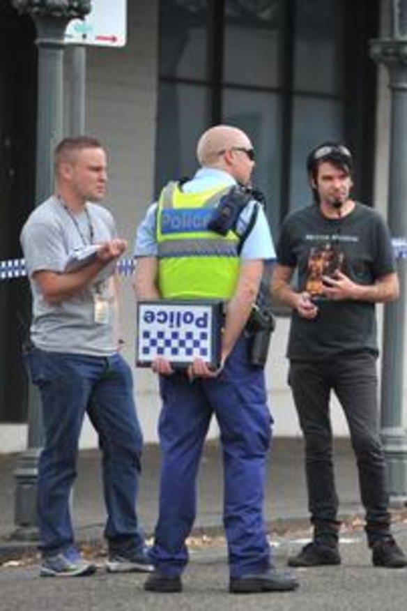 Police outside the house in North Carlton where the body of Greg Ham was found yesterday.