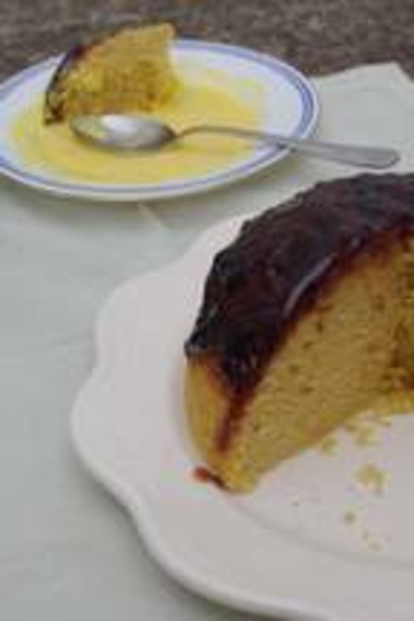 Old-fashioned sponge cake with plum jam and custard.