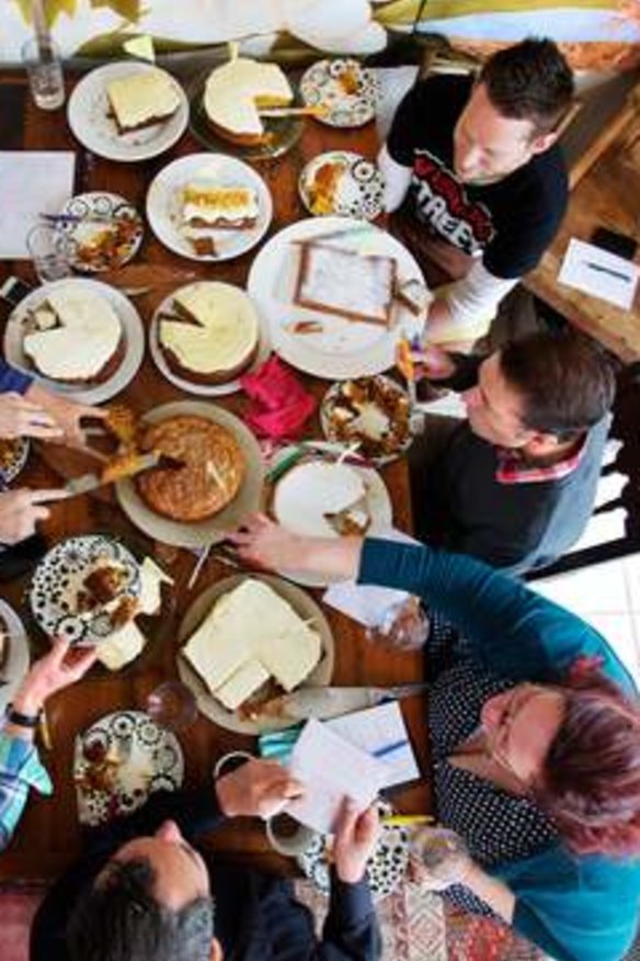 A trying time: Judges sample the shortlisted carrot cakes.