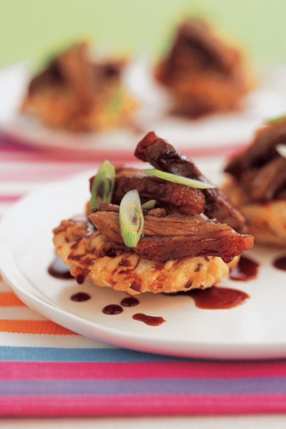 Noodle cakes topped with Chinese barbecue duck