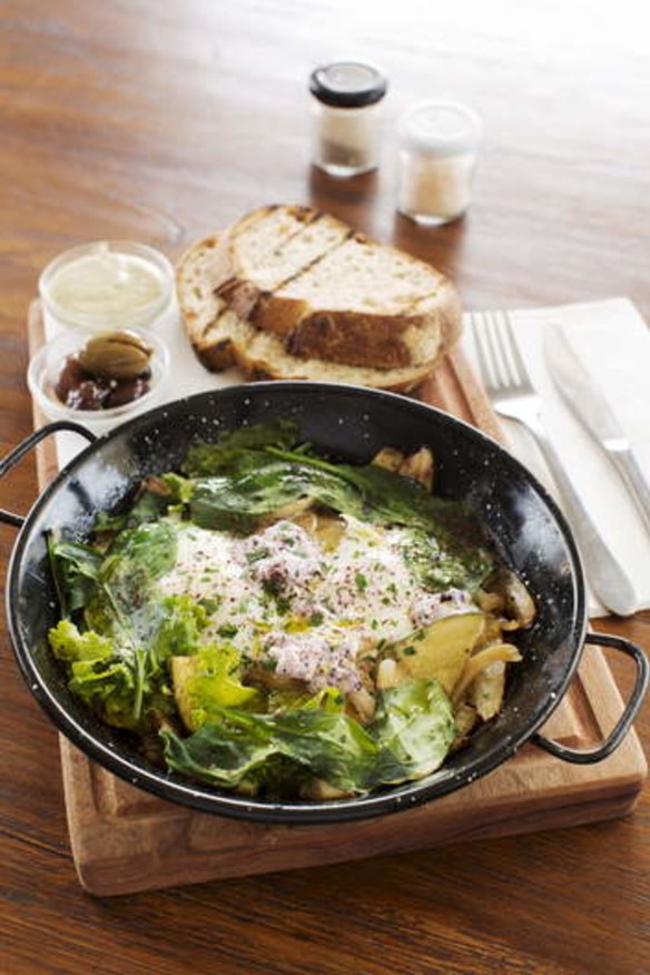 Green shakshuka with olives and grilled sourdough.