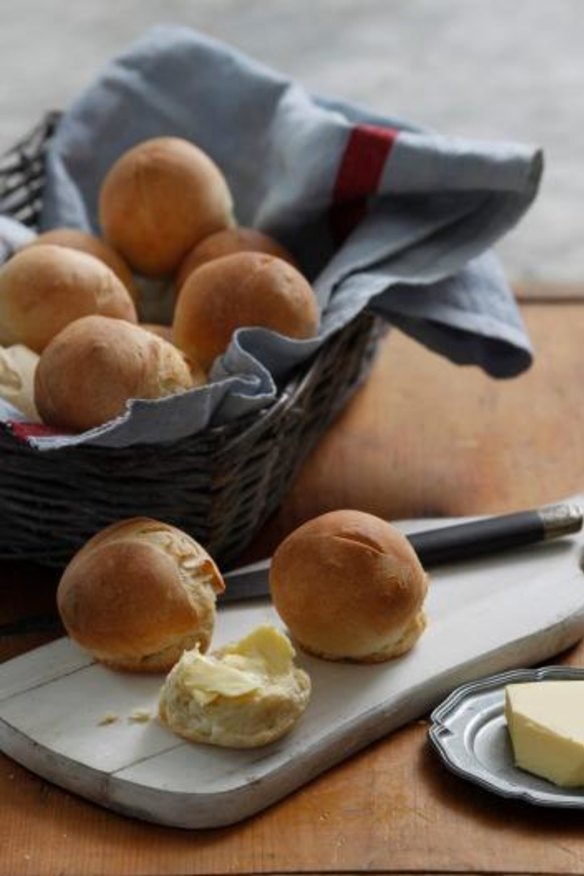 You should break open dinner rolls and butter each piece before eating.
