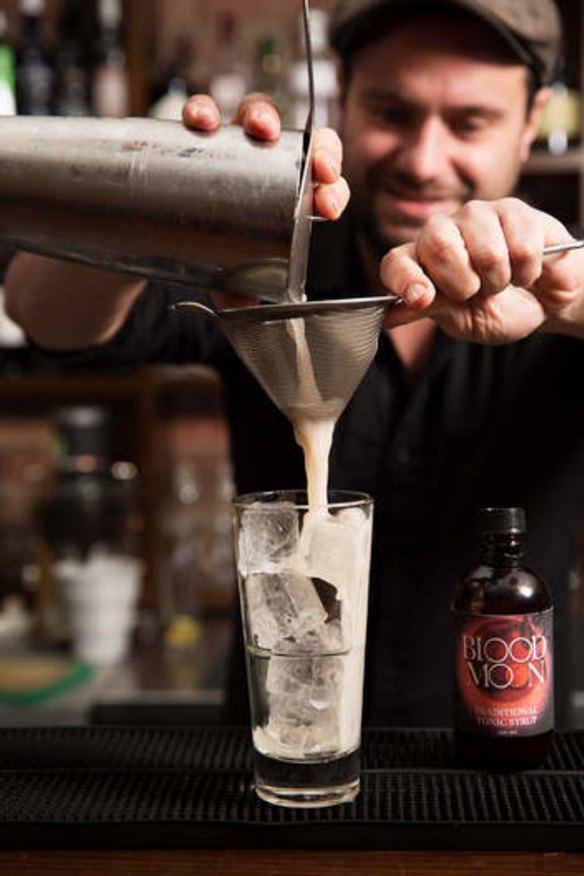 The Collection Bar's Owen Westman makes a drink using diluted Blood Moon tonic syrup.