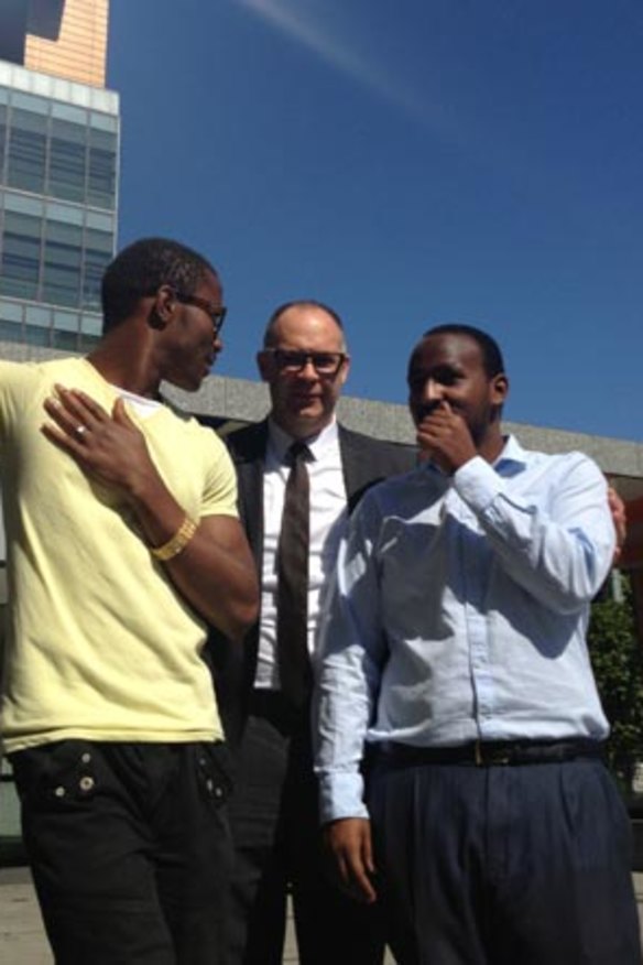 Peter Seidel, public interest partner at Arnold Bloch Leibler, which represented the men. Applicant Daniel Haile-Michael is in the blue shirt.