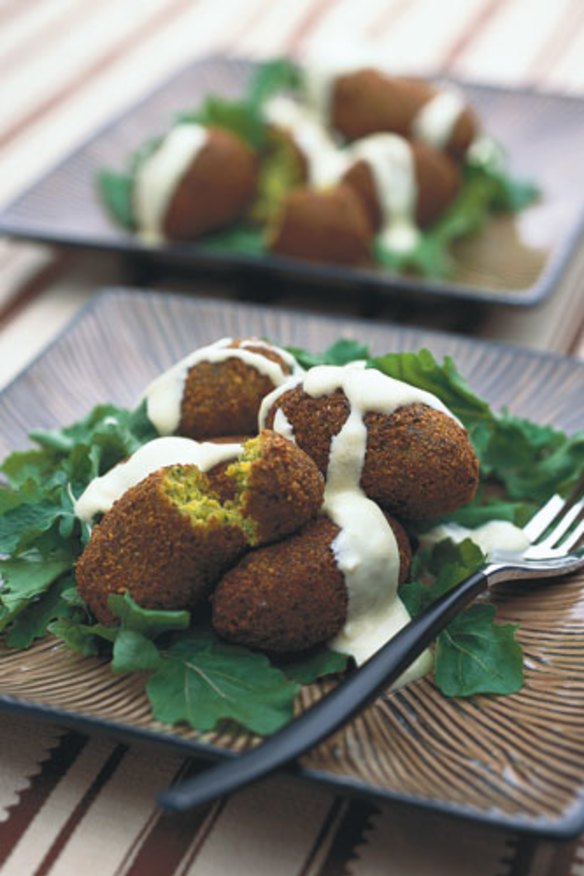 Falafels drizzled with creamy tahini.