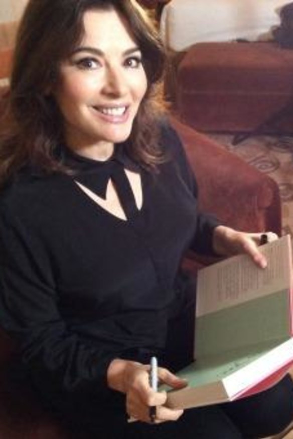 Nigella Lawson signs a copy of her latest cookbook for goodfood.com.au.