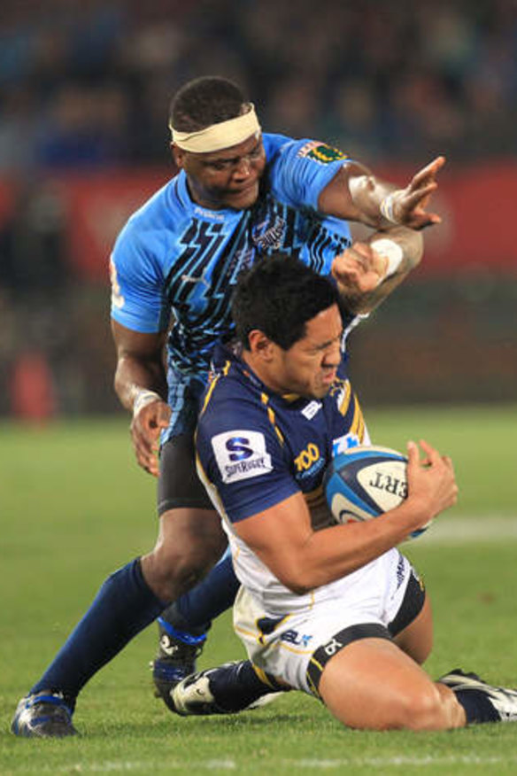 Brumbies winger Joe Tomane cleans up possession.