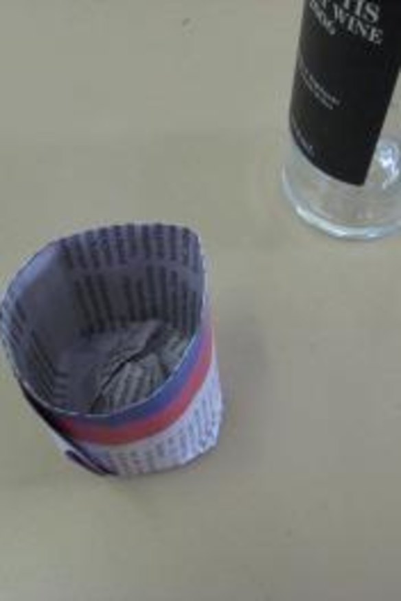 Finished: slip the paper pot off the bottle to use for raising vegetable seeds.