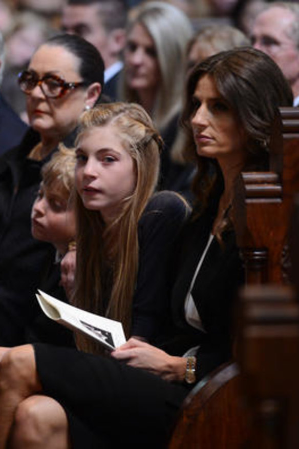 Sam Stynes mourns her husband during the service, with daughter Matisse and son Tiernan beside her.