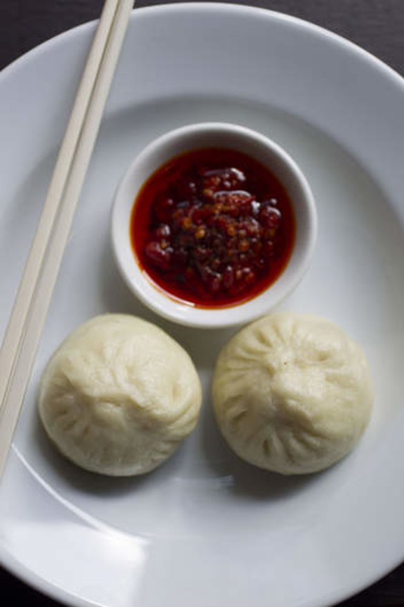 Steamed mini pork buns with house-made chilli