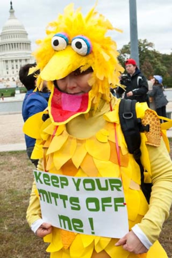 Muppets meet politics ... a woman supports public broadcasting at the weekend.