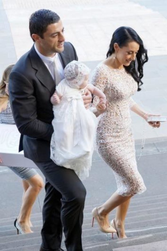 The happy family arrives at St Mary's Cathedral.