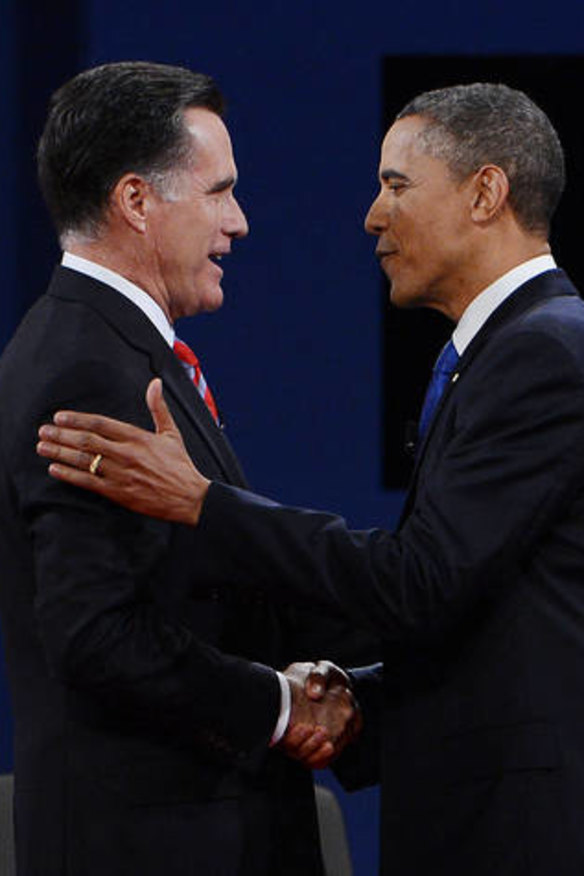 Making friends ...  Barack Obama and  Mitt Romney arrive on stage for the third presidential debate  in Boca Raton.