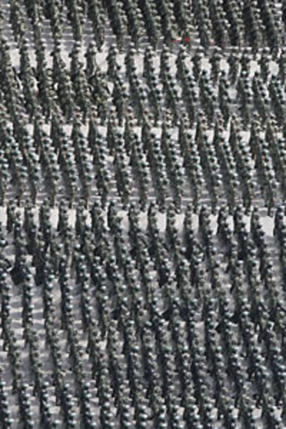 Gathering numbers... Chinese security forces assemble at a square in Urumqi.