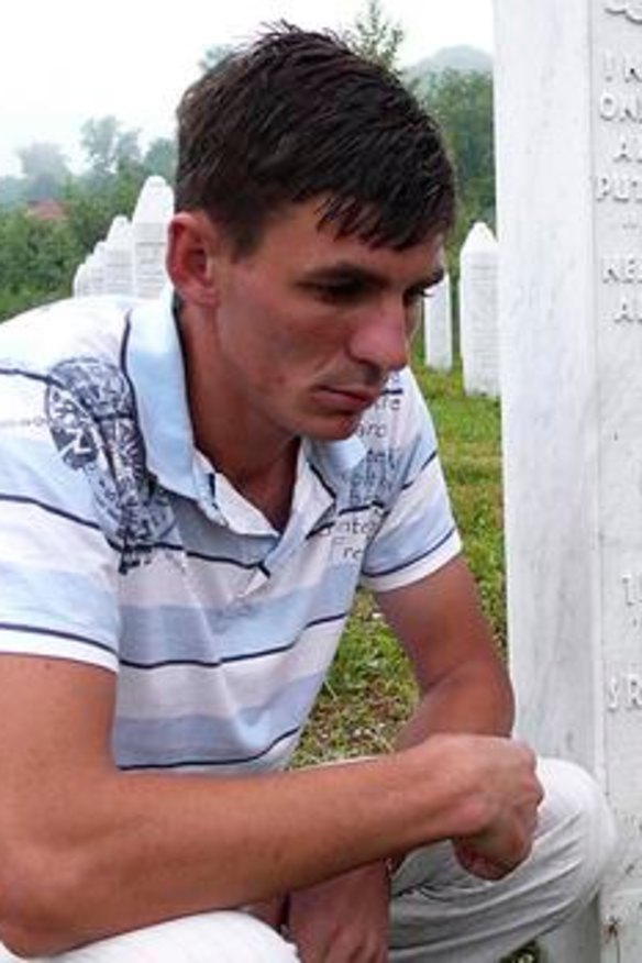 Mr Alic at the graveyard where his father and uncle are now buried.