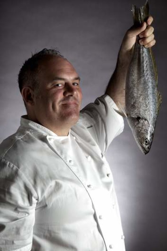 Chef and sustainable seafood advocate Paul Wilson with a teraglin, which he describes as 'Delicious, like European sea bass but $5 to $8 a kilo'.