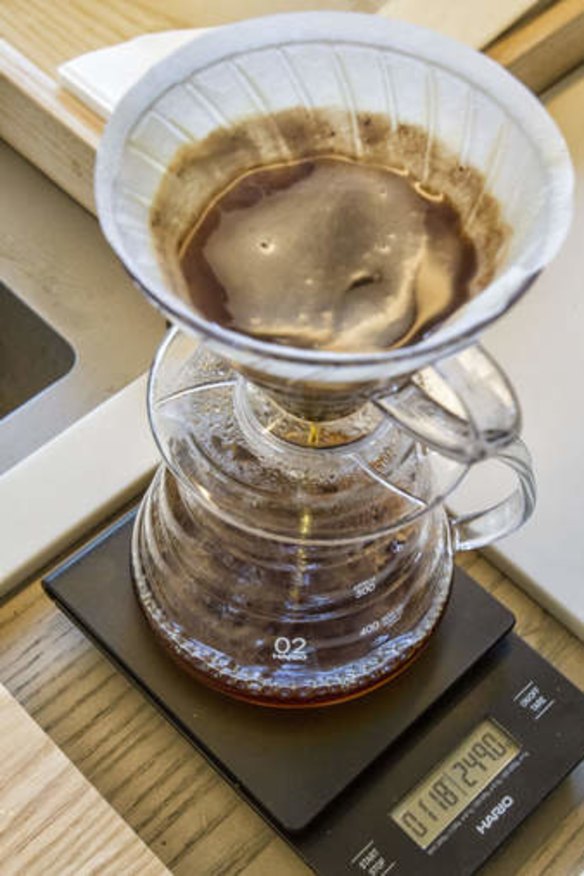 A pourover coffee is prepared at Filter.